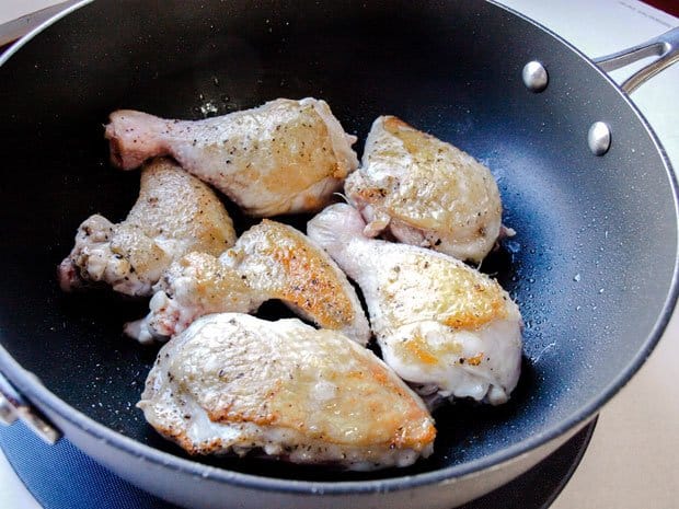 Brown the chicken in a pan 