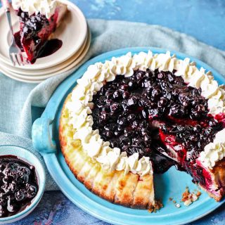 Blackcurrant Cheesecake with slice of cheesecake and compote