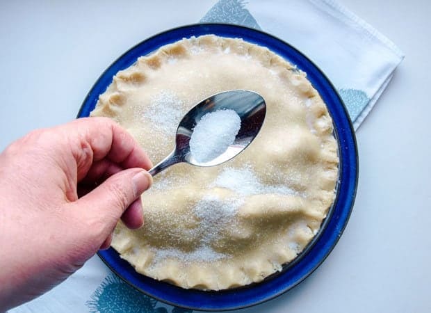 Brush the tart with milk and sprinkle with sugar