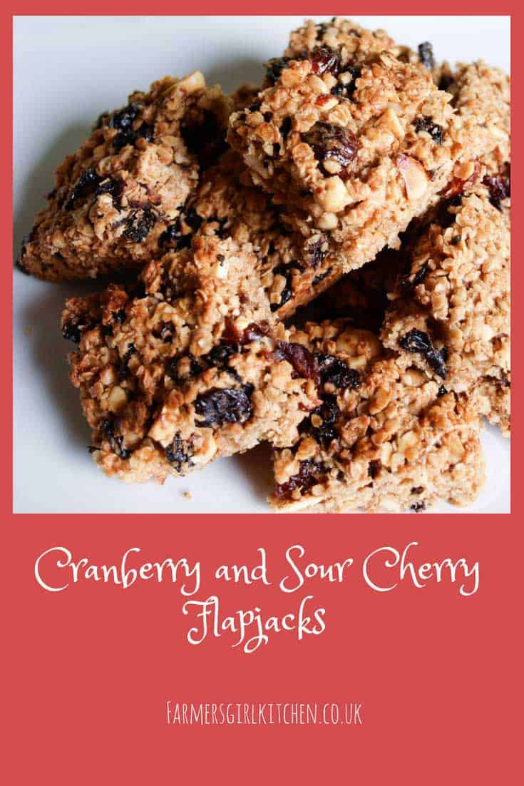 Who could resist these Cranberry and Sour Cherry Flapjacks? They are packed full of flavour and a cake box favourite with all the family #flapjacks #cookies #cranberry #cranberries #cherries