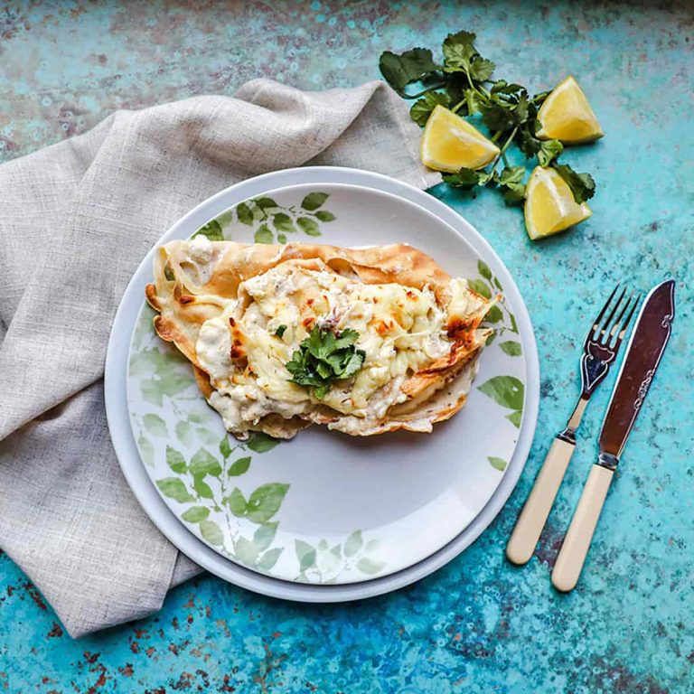 Seafood Pancake on plate with lemons and parsley