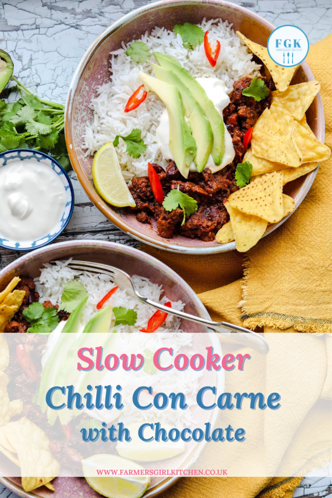 Slow Cooker chilli con carne with Chocolate in two bowls with toppings