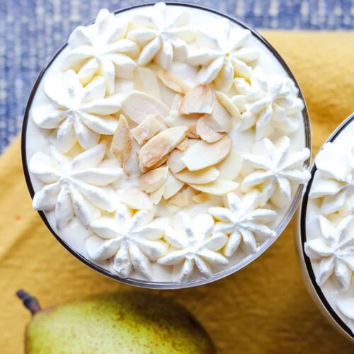 Jamaica Ginger Cake & Pear Trifles decorated with flaked almonds