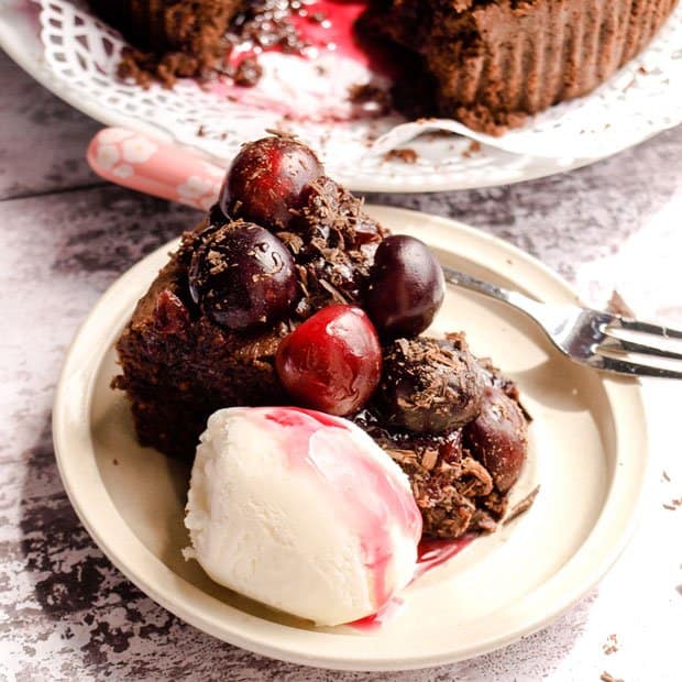 Serving Chocolate Cherry Brownie Cake with ice cream 