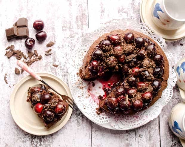 Chocolate Cake with cherry topping, cups and plate 