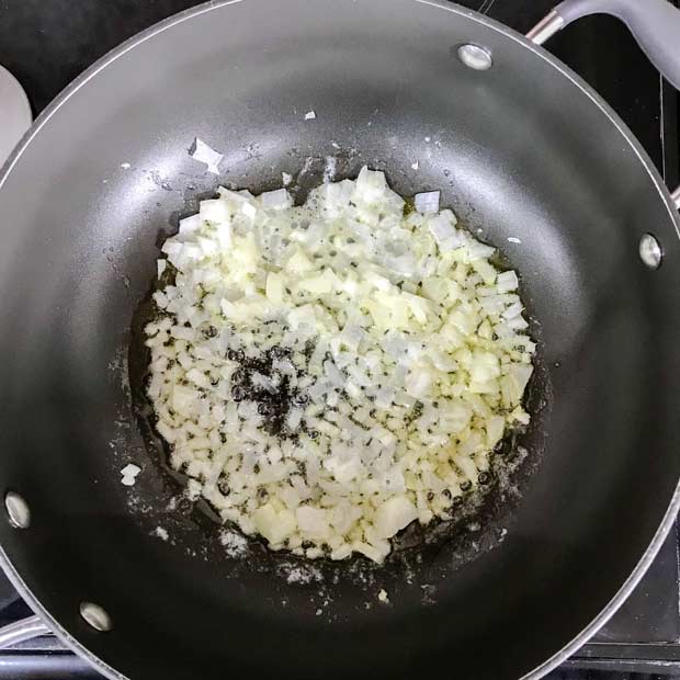 Pan with onions cooking