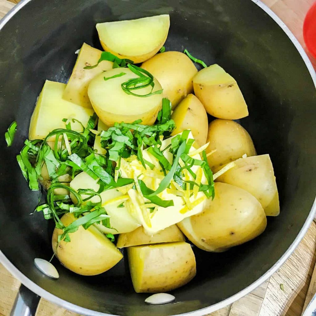pan of new potatoes with wild garlic and lemon 