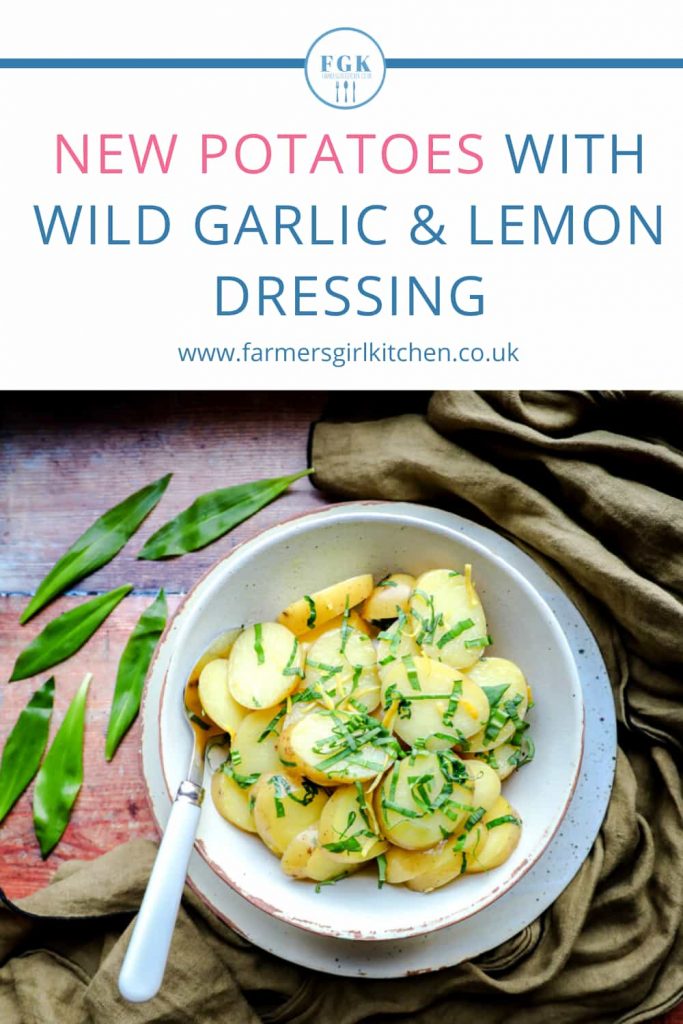 Bowl of New Potatoes with Wild Garlic & Lemon Dressing and wild garlic leaves