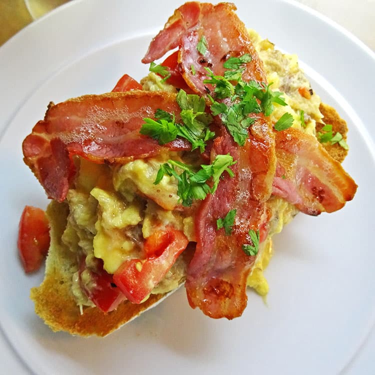 scrambled eggs with smoked mackerel, bacon and tomatoes.