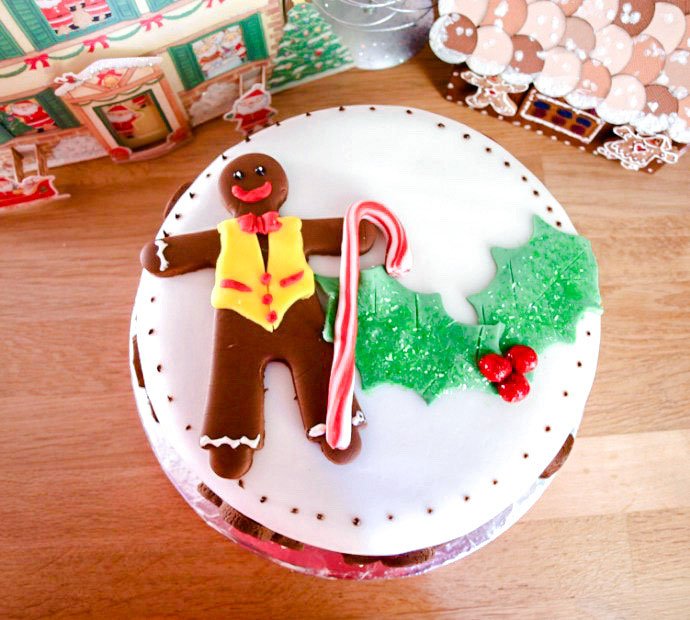 Gingerbread Man and holly leaves on Christmas Cake.