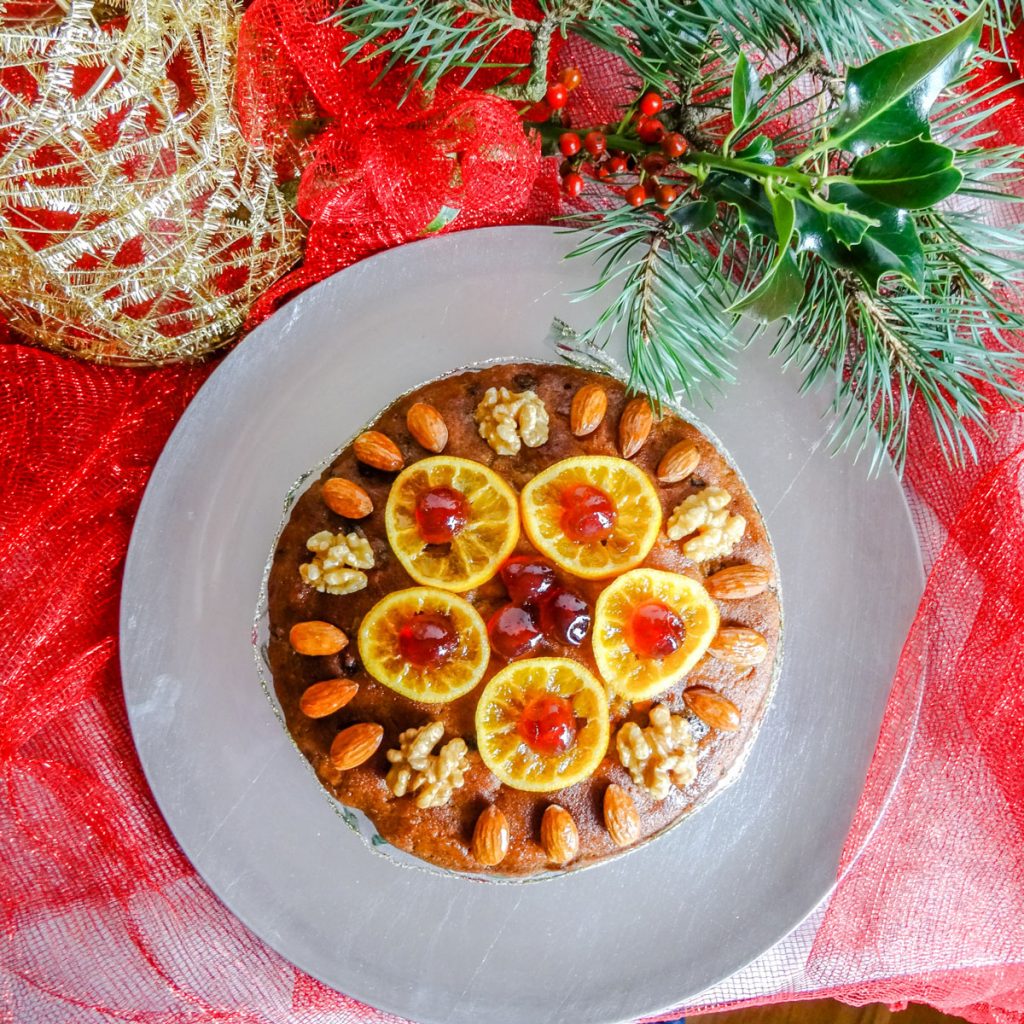 Fruit cake on silver plate with holly