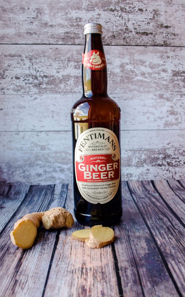 Fentiman's Ginger Beer Botthle with fresh root ginger.