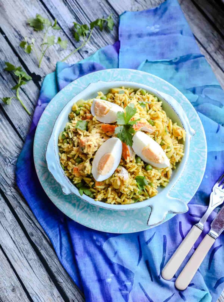 Easy Smoked Mackerel Kedgeree on fish shaped plate with cutlery 
