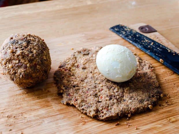 wrap the hard boiled egg in the vegetarian haggis