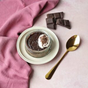 single chocolate pot with spoon and chocolate.