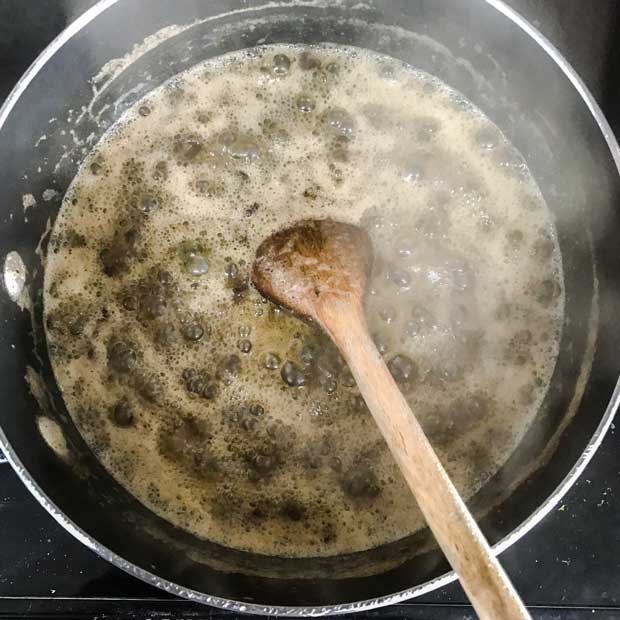 Pan of fruit and butter simmering for cloutie dumpling