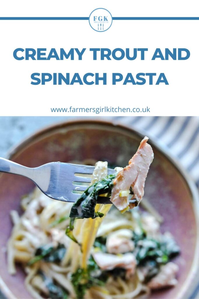 creamy trout and spinach pasta on fork