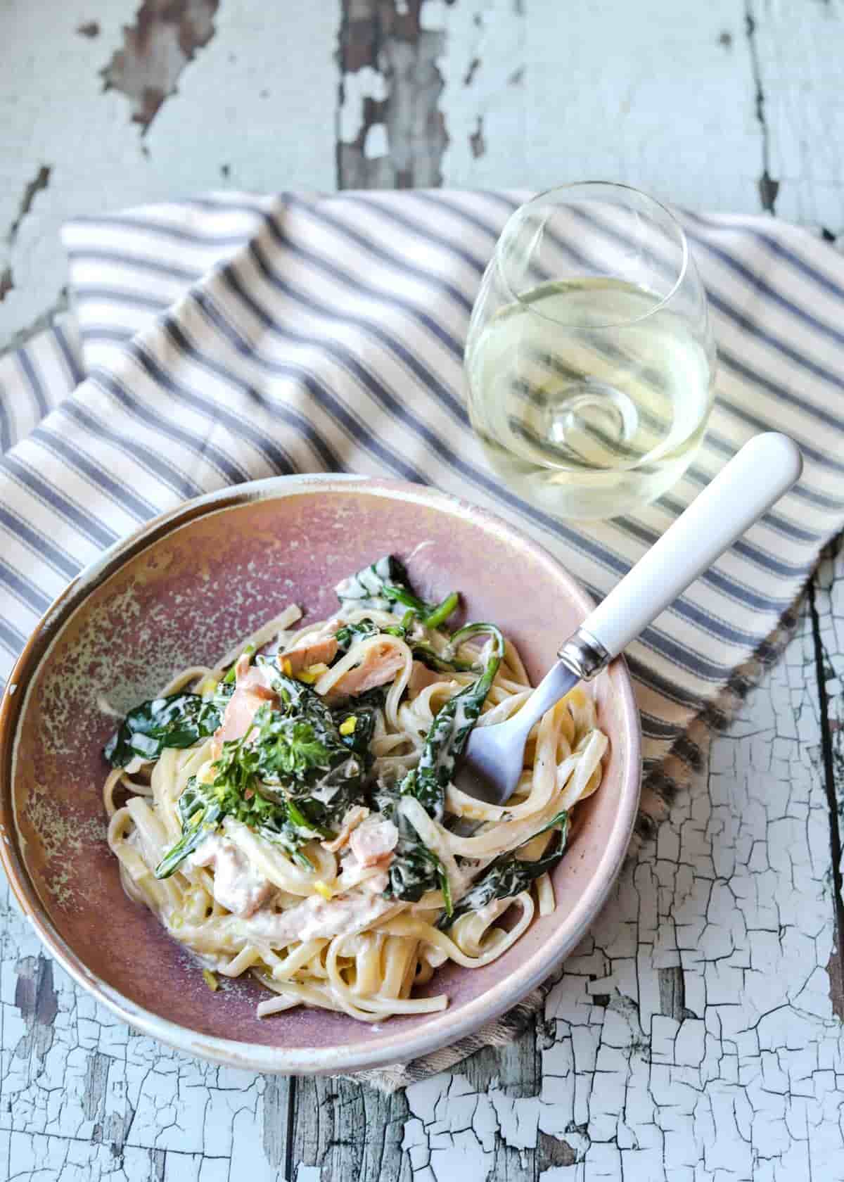 Creamy Trout and Spinach Pasta with fork in pasta