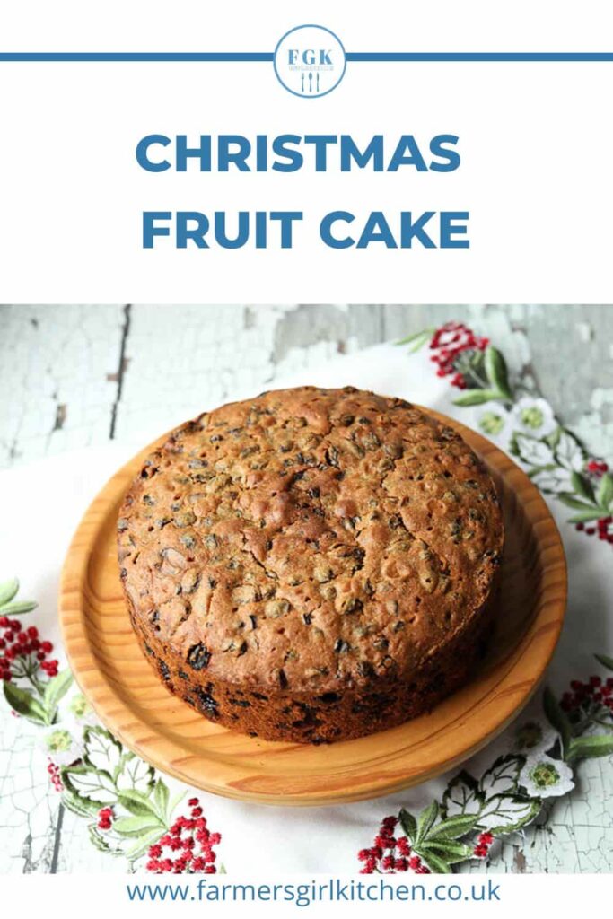 Christmas fruit cake on festive cloth.