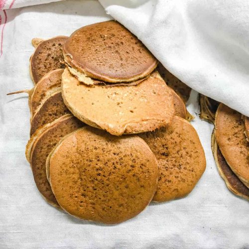 Cinnamon Spice Pancakes cooling in tea towel