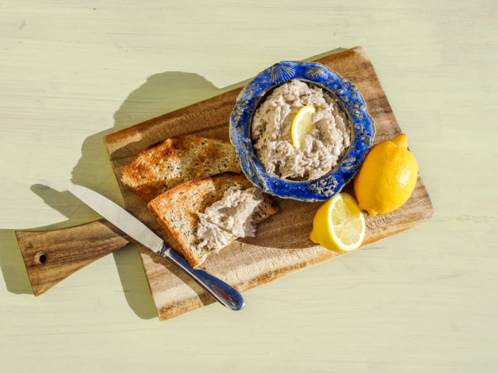 Smoked Mackerel Pate on board with toast and lemons