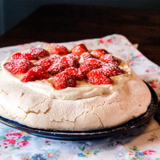Strawberries top a glorious sweet meringue base with the tang of lemon curd cream to bring it together
