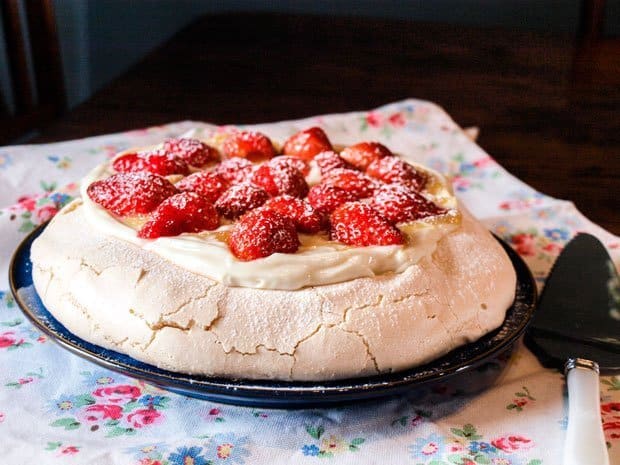Strawberries top a glorious sweet meringue base with the tang of lemon curd cream to bring it together