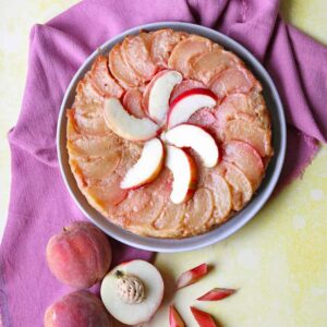 peach and rhubarb upside down cake with peaches and rhubarb pieces.