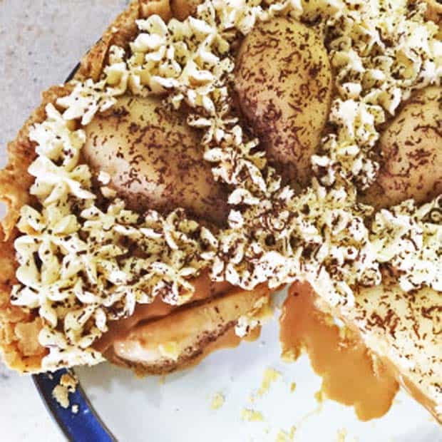 Pear and Caramel Tart with a slice or two cut from it
