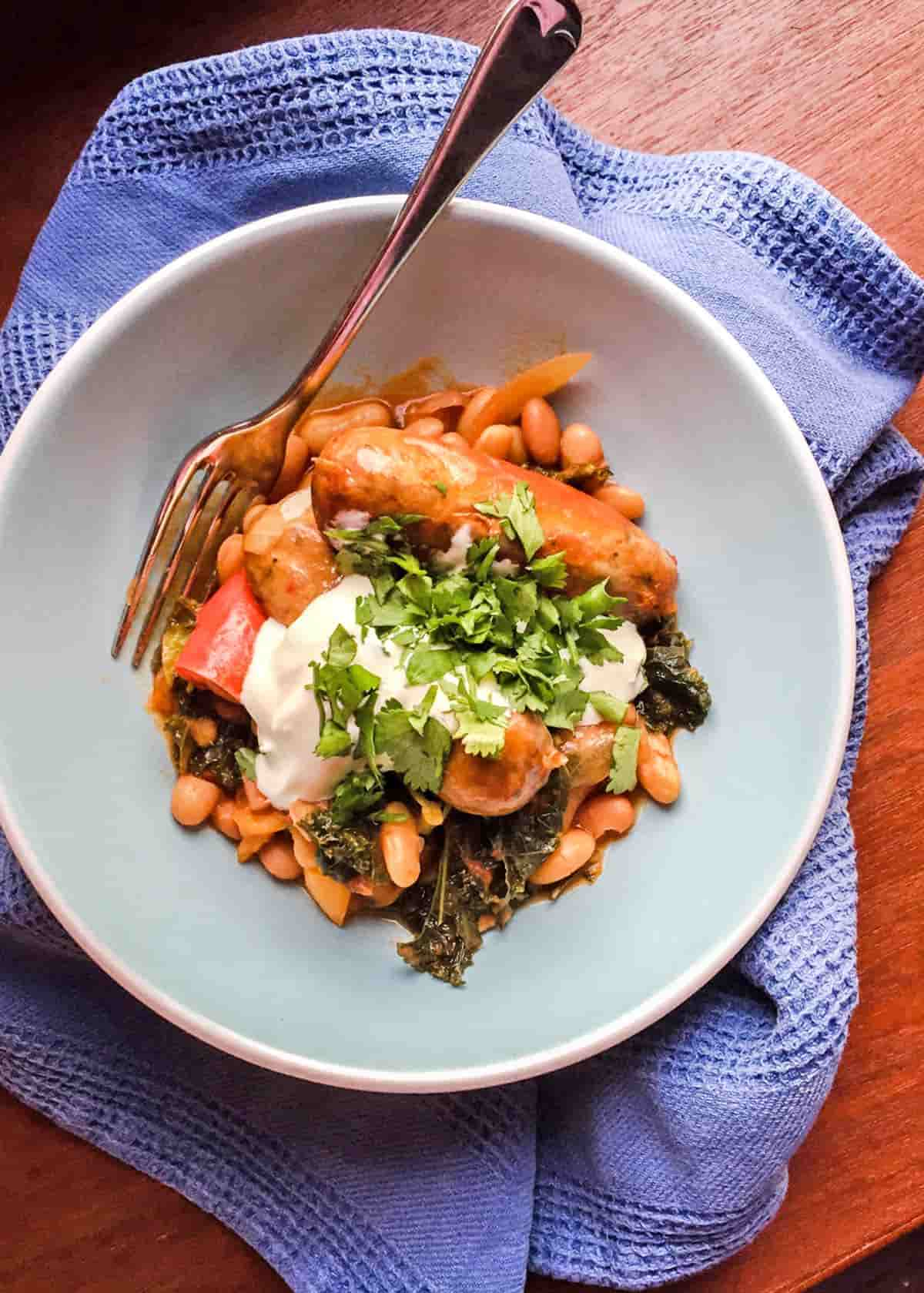 Slow Cooker Sausage Casserole in bowl with fork