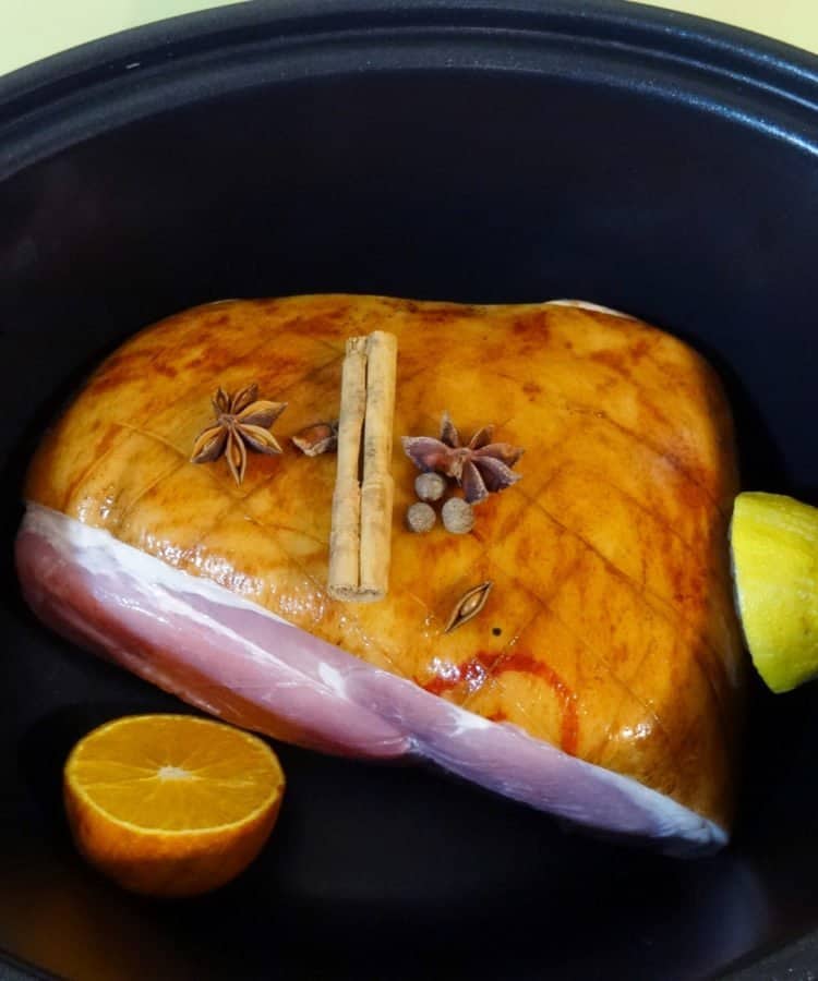 Ham cooked in the slow cooker with oranges and lemons ans spices