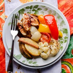 Marmalade marinated chicken with roasted vegetables plated