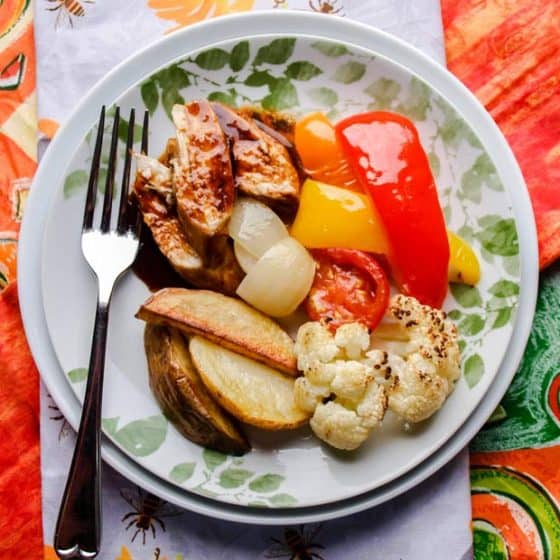 Marmalade marinated chicken with roasted vegetables plated