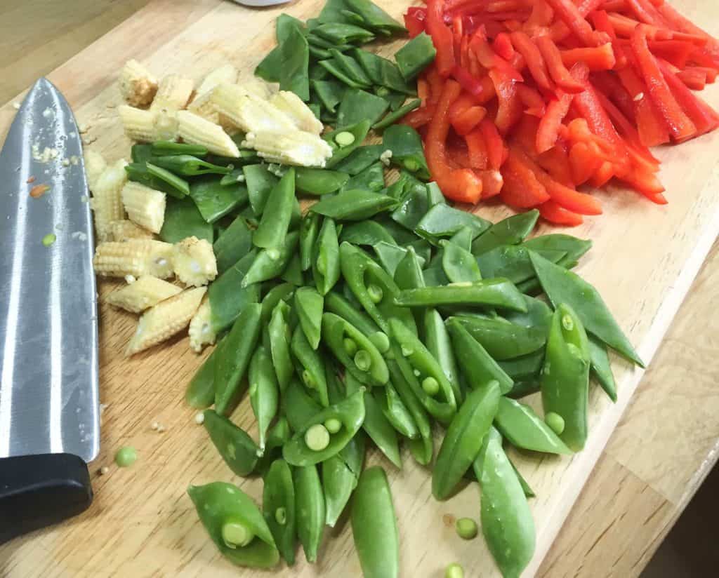 Peppers, mangetout peas and baby corn