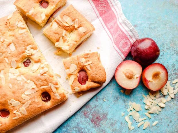 Plum and almond cake cut into squares