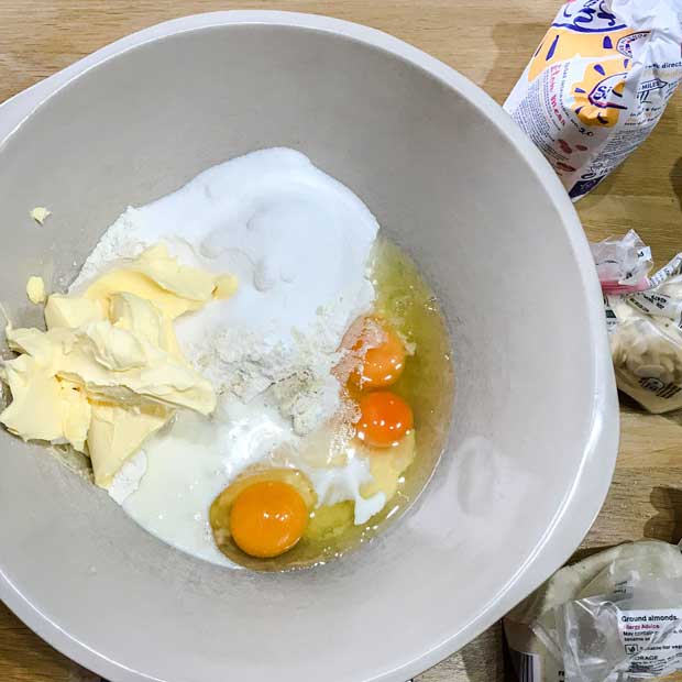 Bowl with butter, eggs, flour and sugar