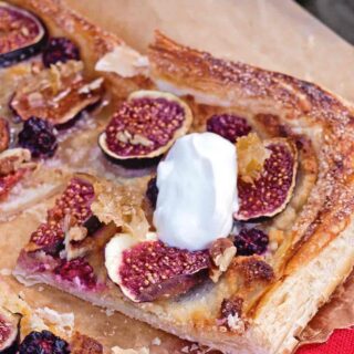 Slice of Fig Honey and Almond Tart with creme fraiche