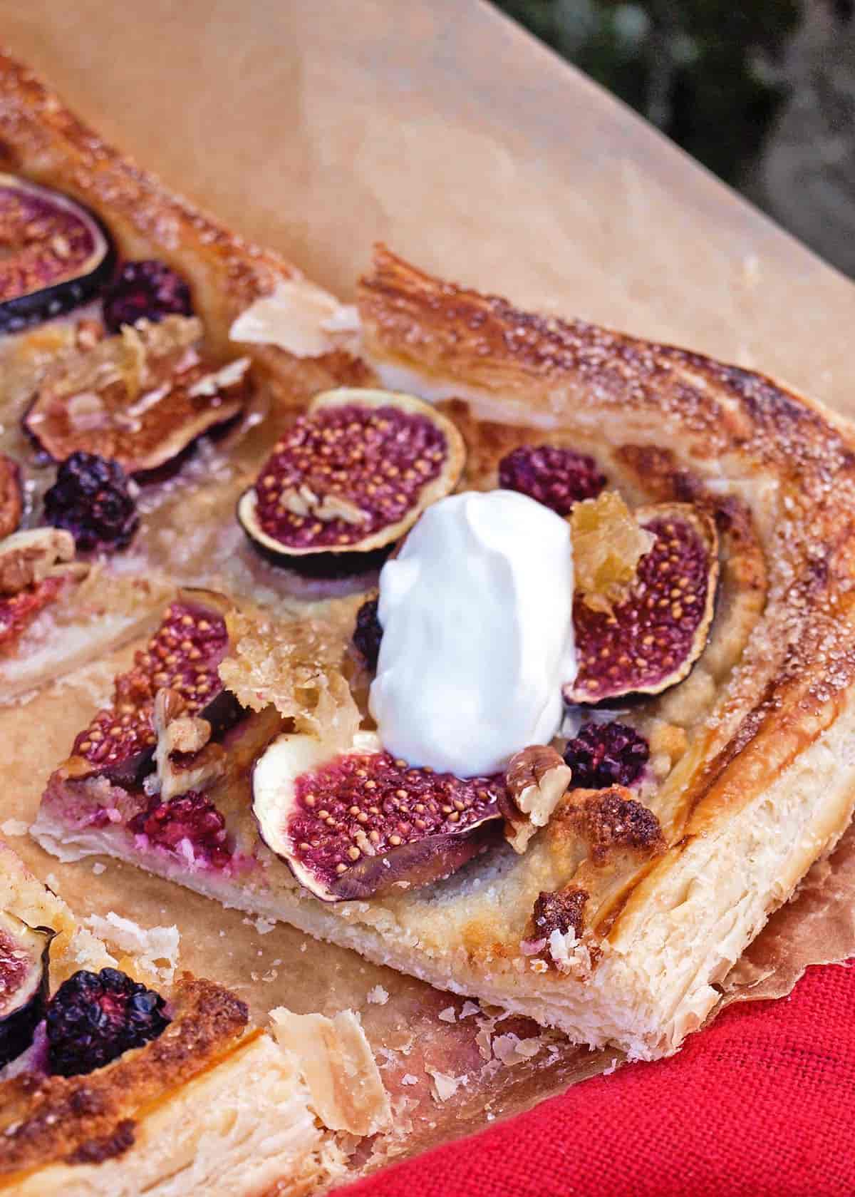 Slice of Fig Honey and Almond Tart with creme fraiche