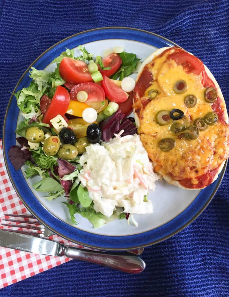 Serve your quick and easy pitta pizzas with salad and coleslaw