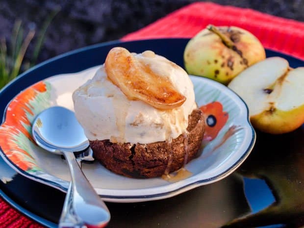 Cookie Cup with scoop of Caramel Apple Ice Cream apple on top and halved apples on the side