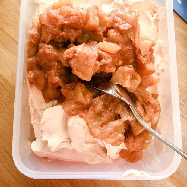 container with ice cream and cooked caramelised apples
