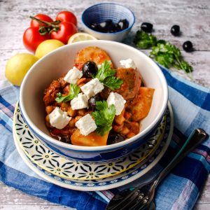 Bowl of Slow Cooker Greek Baker's Pot with olives and tomatoes