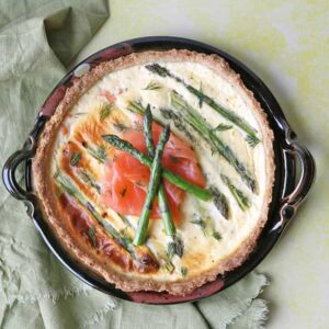 scottish smoked salmon and asparagus tart on platter.