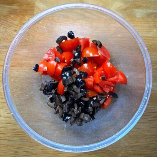 tomato and olives in bowl.
