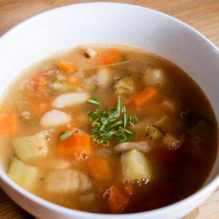 A light and fresh Summer Vegetable Soup with herbs and cannelini beans