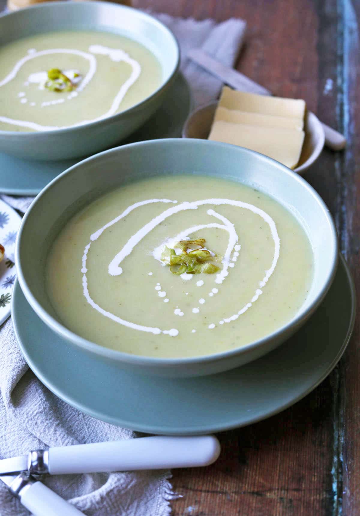 Leek and Potato Soup in bowl with cream