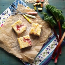 Oaty Rhubarb Cheesecake Bars: Creamy Cheesecake with tart rhubarb on a crispy oat base #cheesecake #rhubarb #oats #bars
