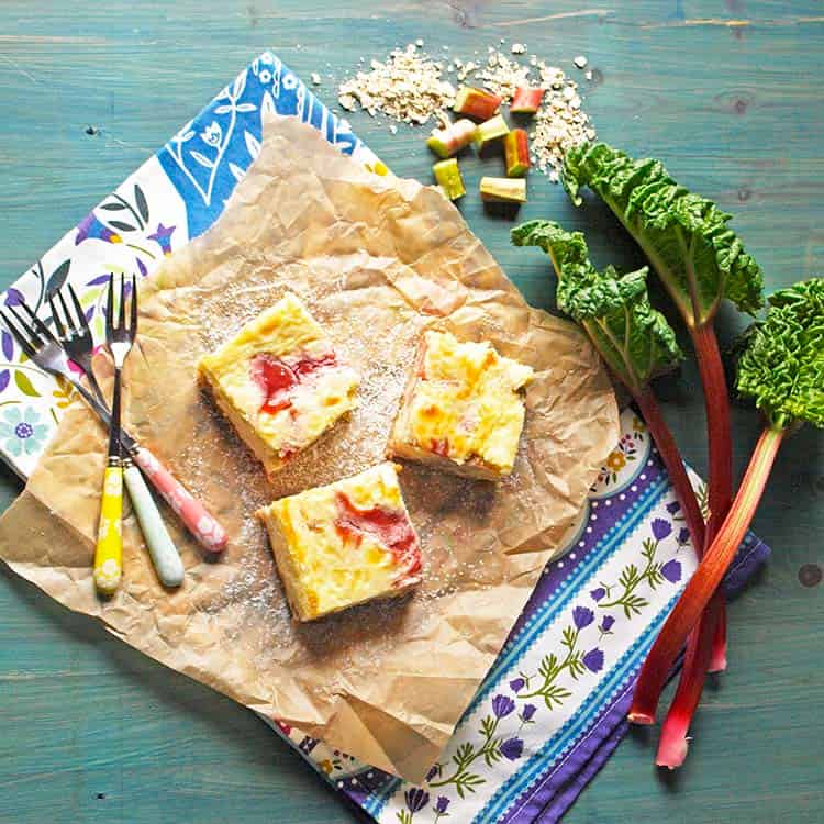 rhubarb cheesecake bars from above with rhubarb and oats.