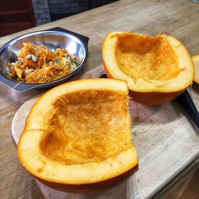 Split your pumpkin, remove the strings and seeds for roast pumpkin seeds