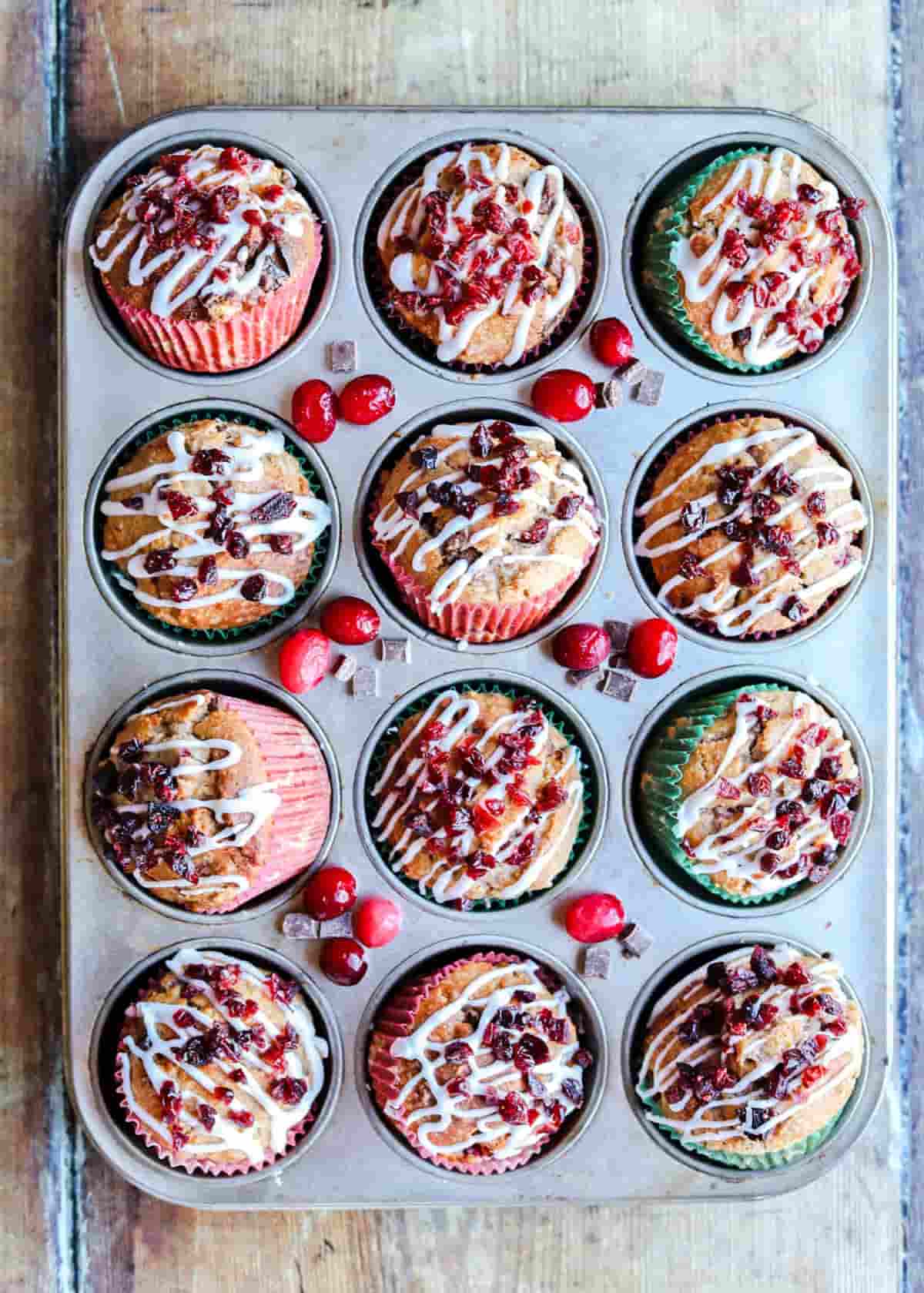 Chocolate and Cranberry Muffins in muffin pan with cranberries
